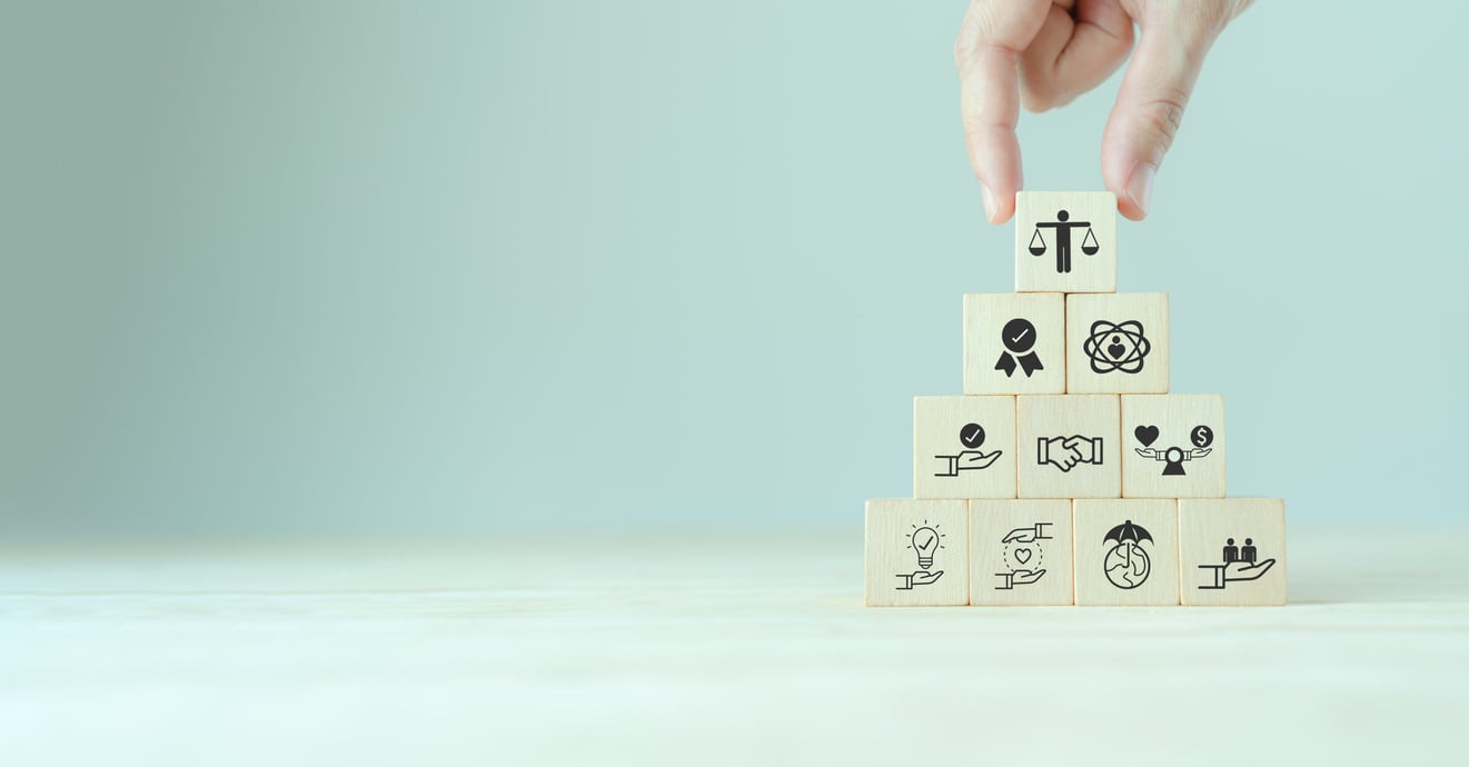 Business ethics concept. Ethical mindset. Business integrity and moral. Putting wooden cubes with ethics icon standing with other ethics icon. Company culture and sustainable success